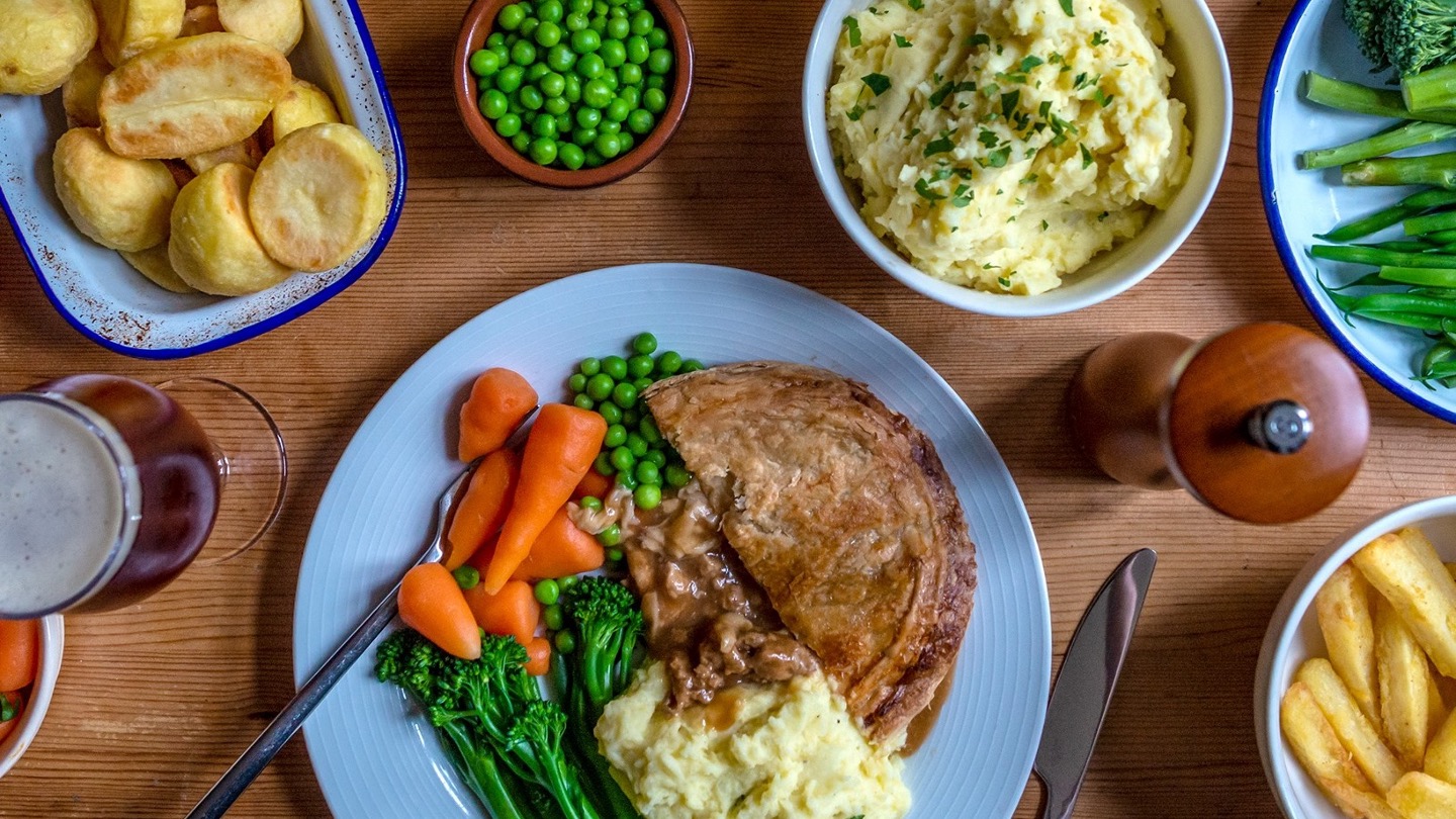 A cooked meal of Fray Bentos food on a dinner table.
